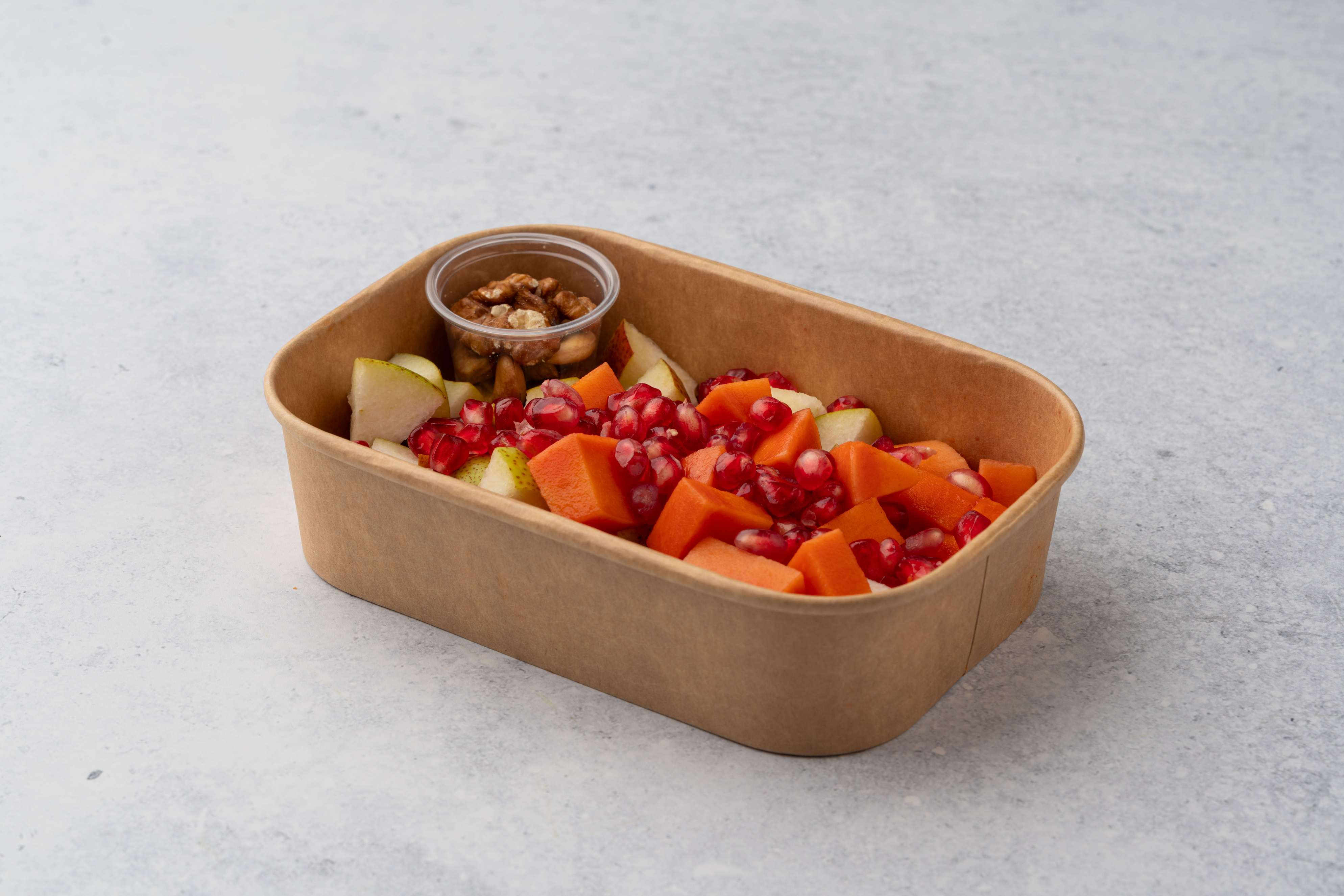 Mix Papaya Pears And Pomegranate Fruit Salad With Nuts